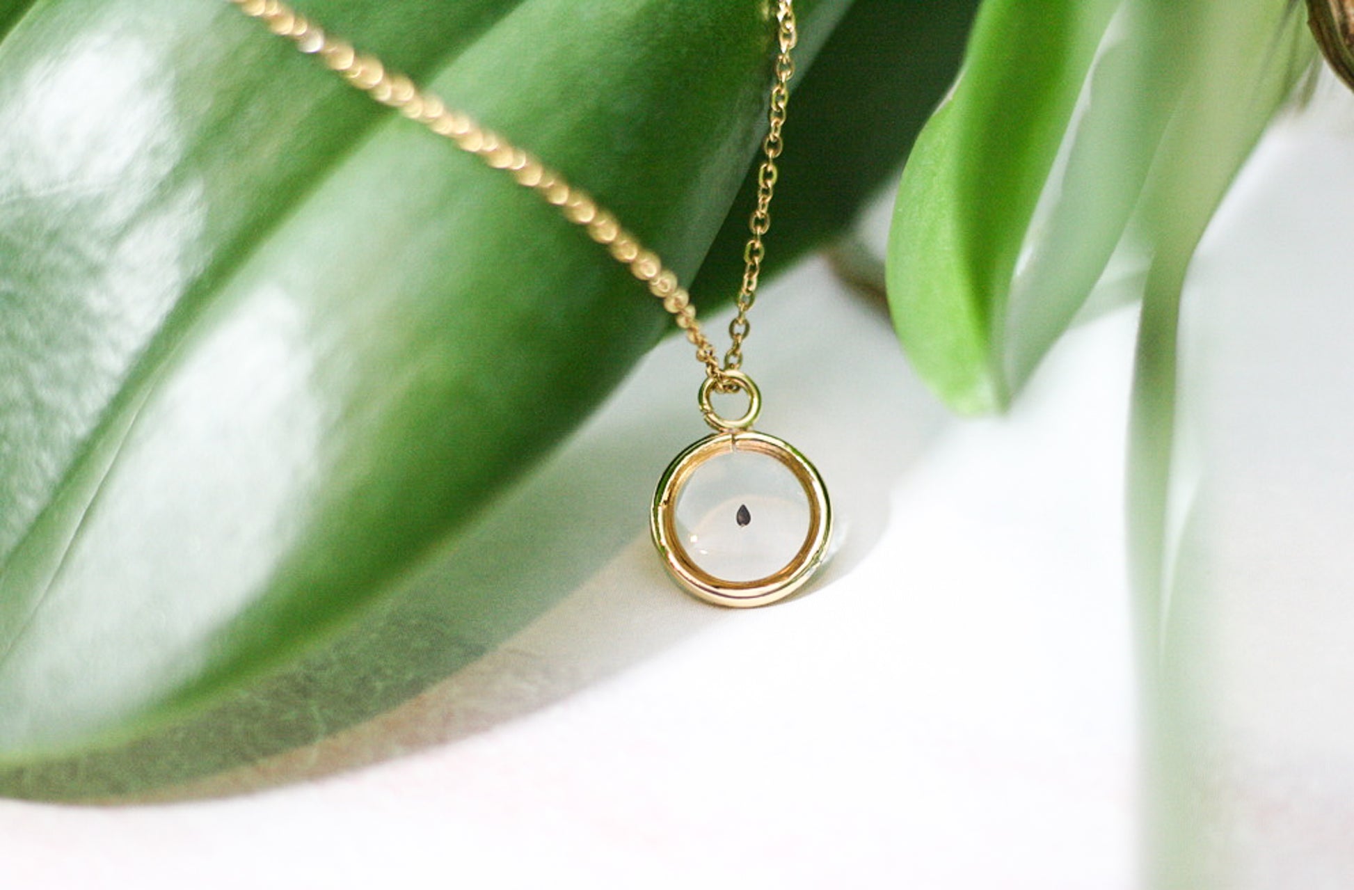 gold pendant with forget me not seed