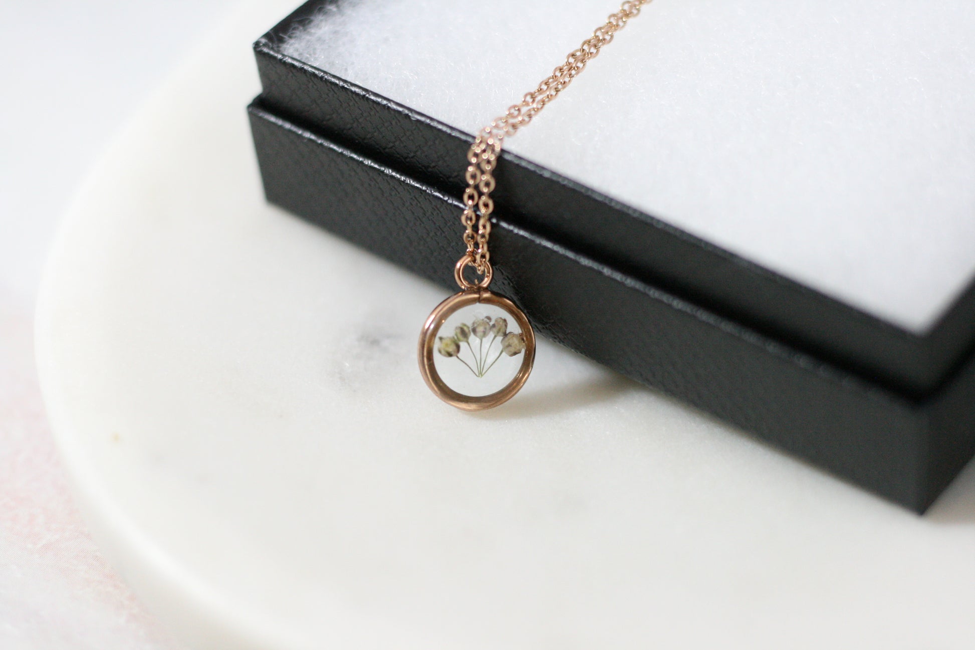 5 pieces of babys breath in a rose gold necklace pendant