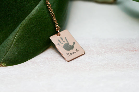 Handprint necklace in rose gold