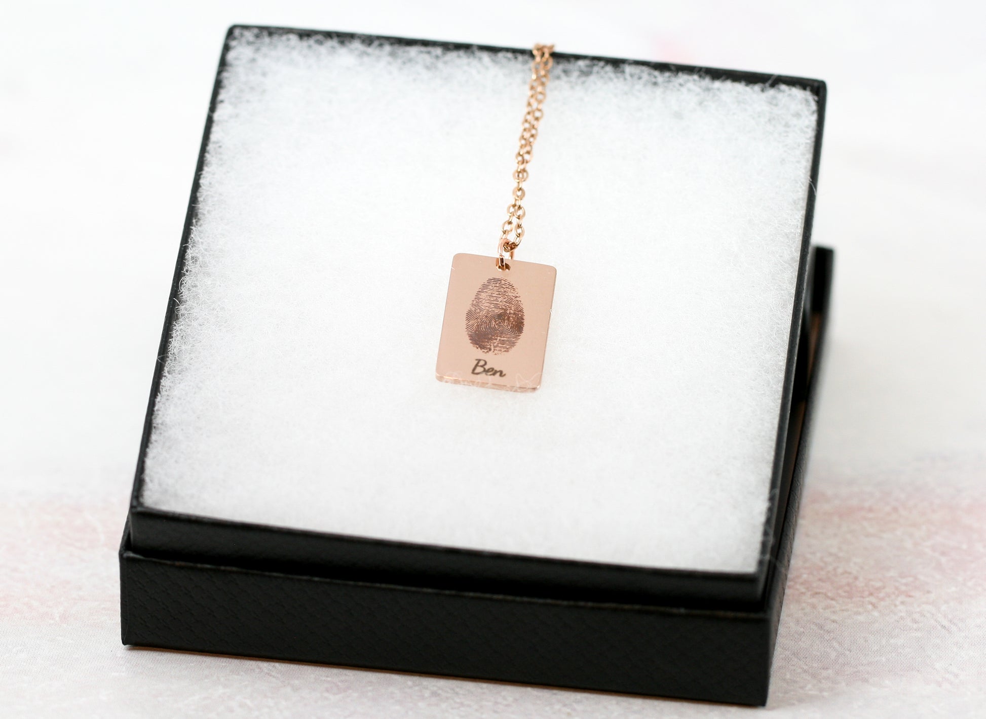 rose gold fingerprint necklace in black jewelry box 