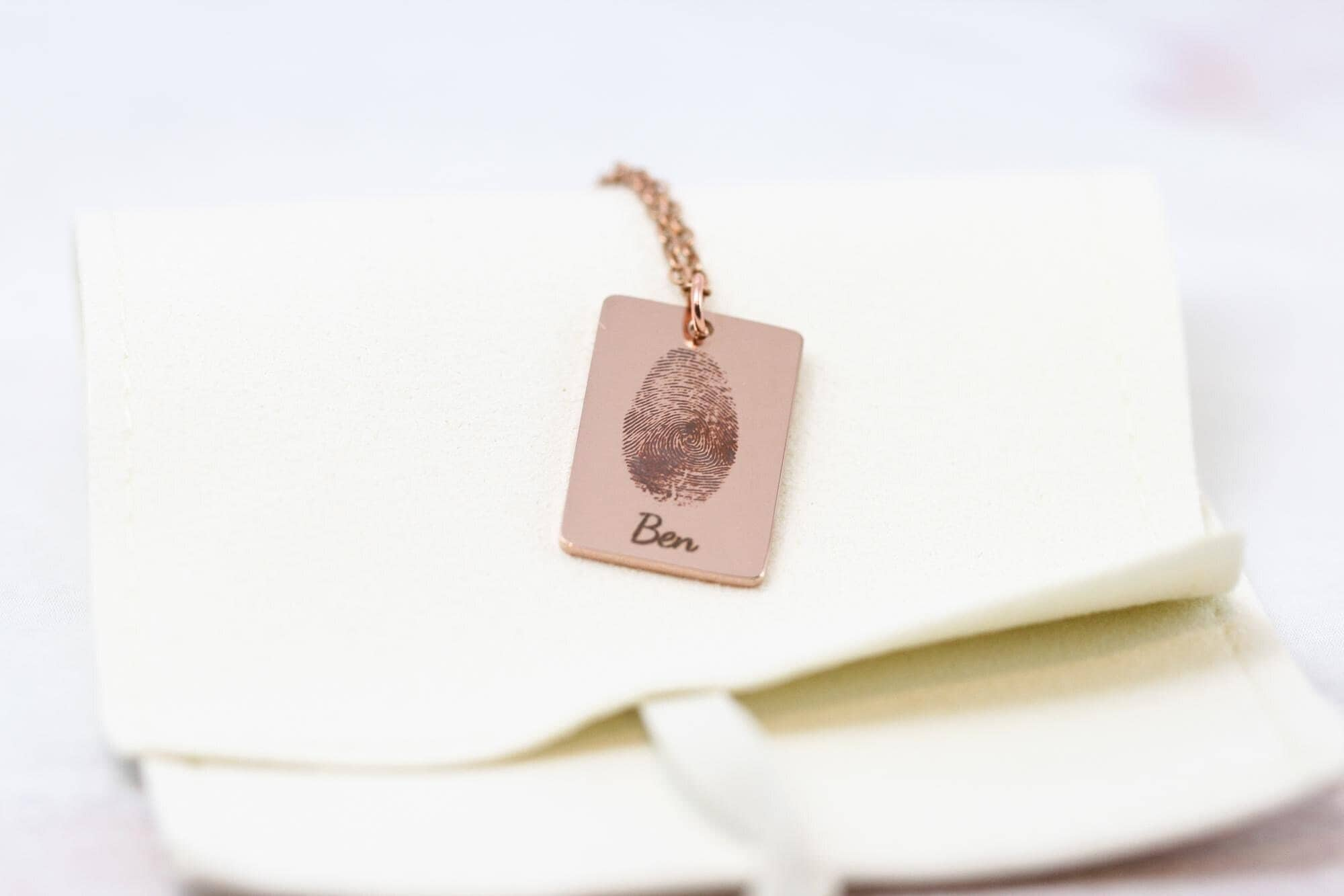 fingerprint engraving necklace with the name 