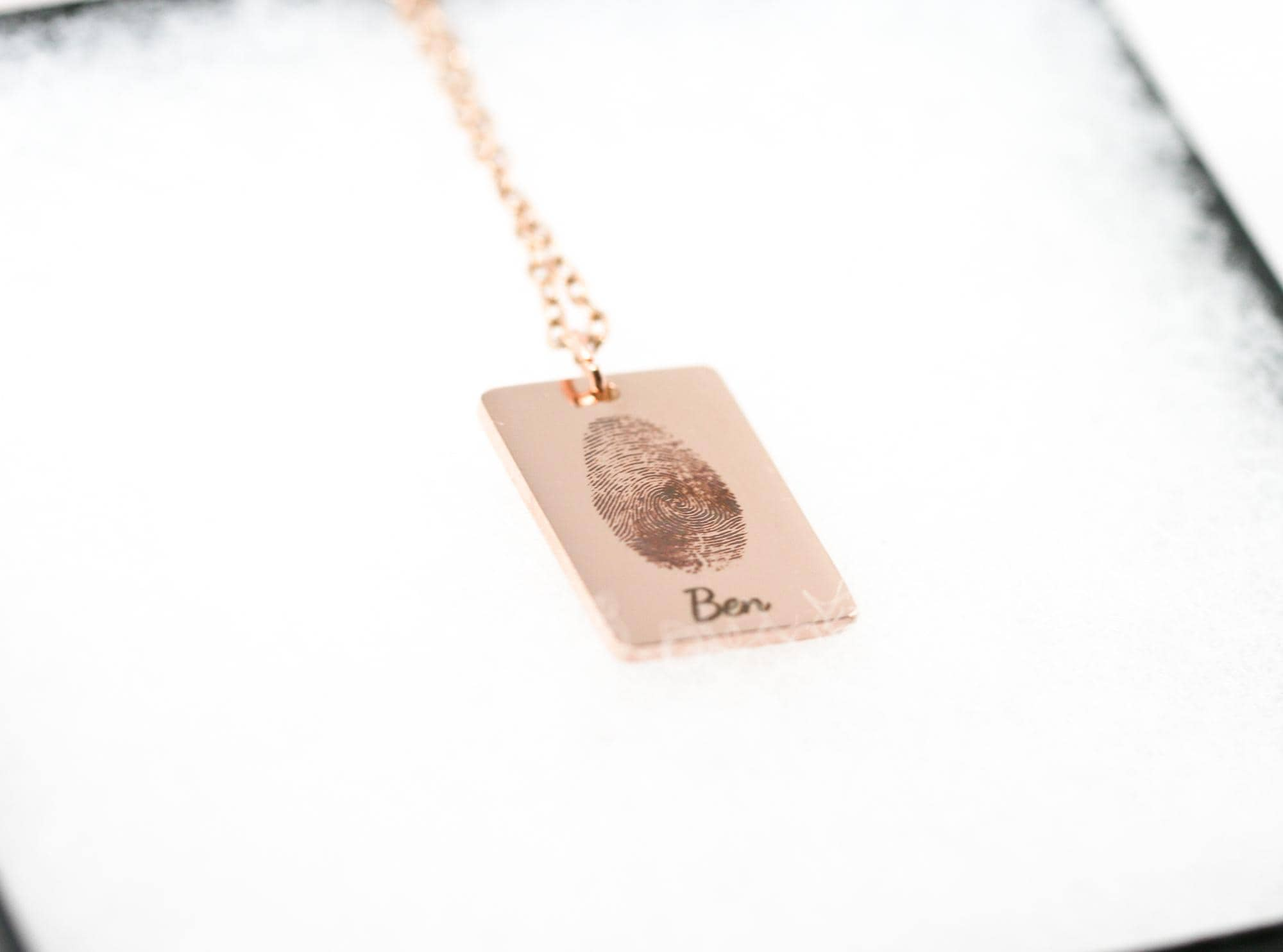 thumbprint necklace in rose gold with the name 