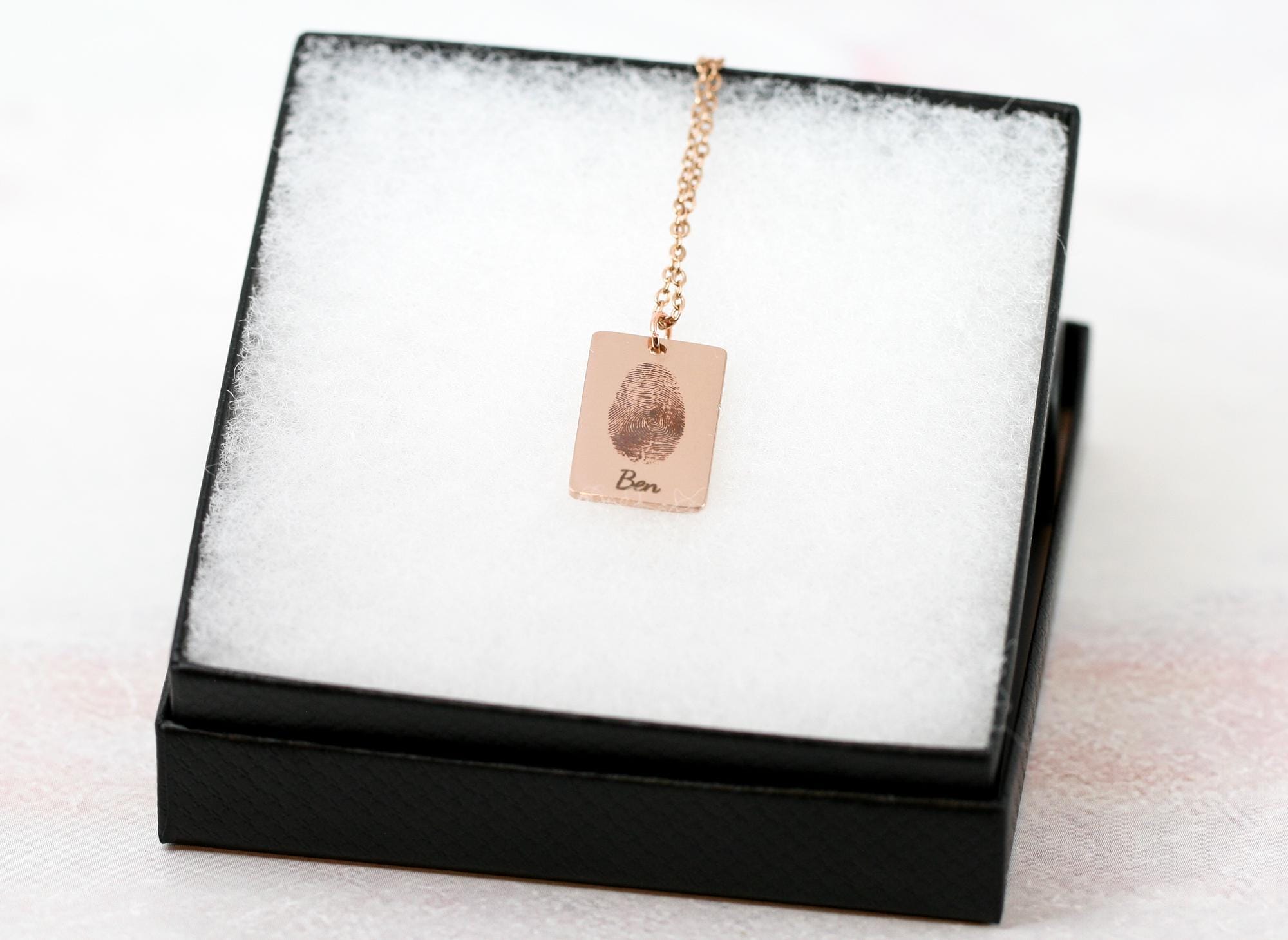 thumbprint necklace in rose gold with the name 