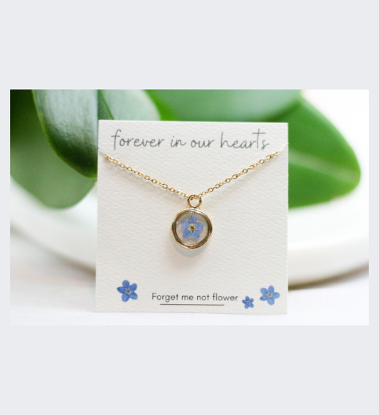 Blue Forget Me Not Flower Necklace with a Gold Circle Pendant