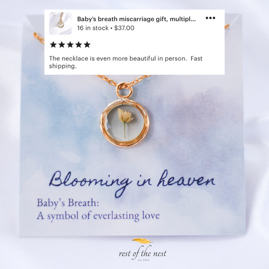 Gold pendant necklace with a piece of babys breath inside. 5 Star customer review reading "the necklace is even more beautiful in person. Fast shipping".