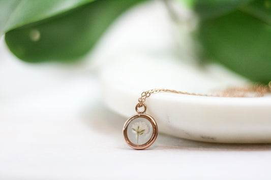 bloomed babys breath in a rose gold pendant necklace