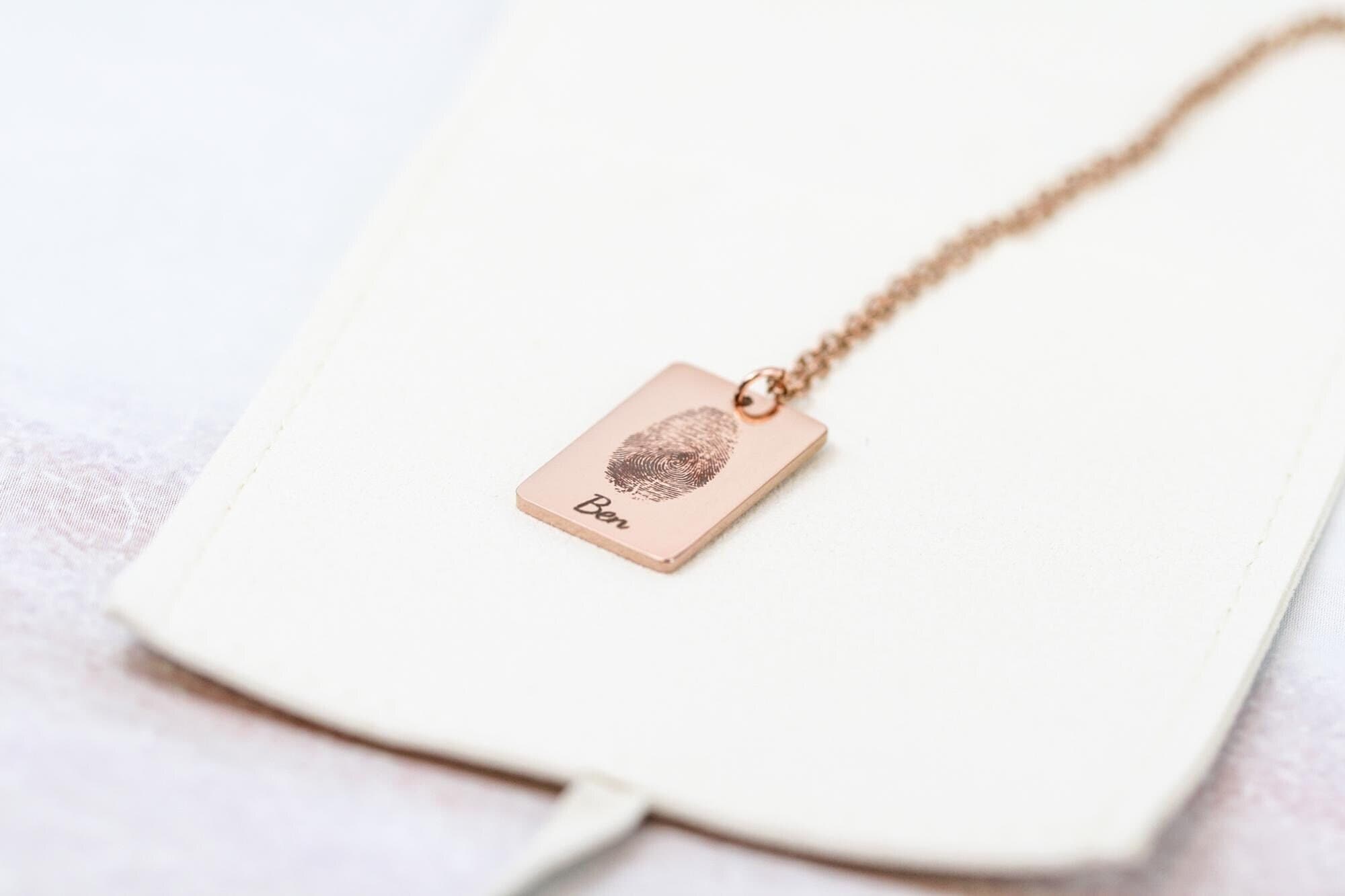 engraved fingerprint necklace  with the name 