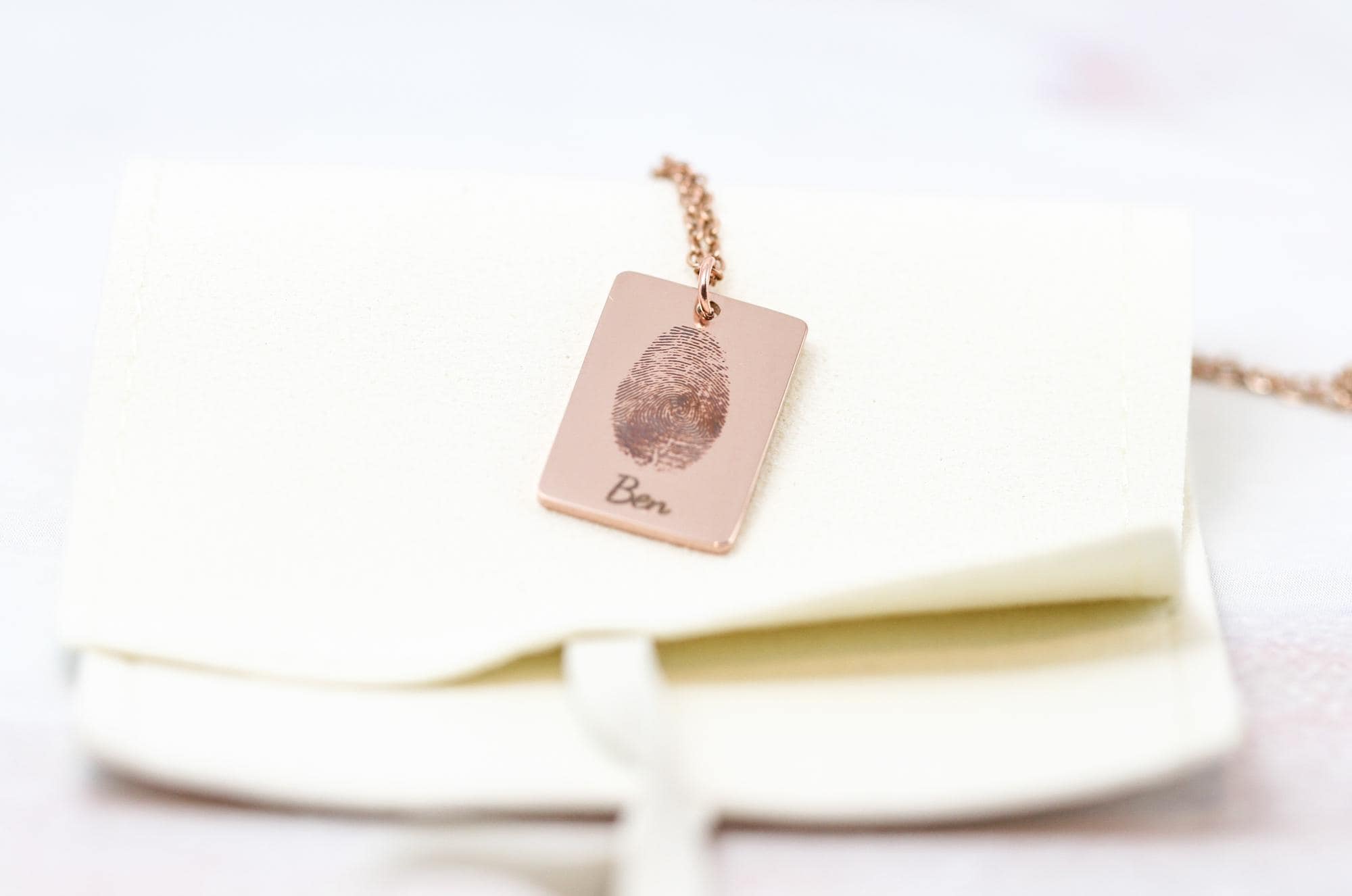 thumbprint necklace in rose gold with the name 